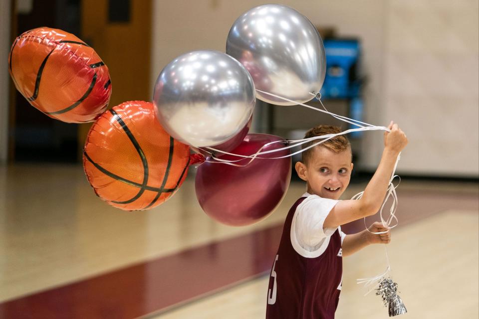 Seth Walsh celebrating during his official signing day with the Bellarmine Basketball team in June of 2022 at the conclusion of a youth basketball camp.