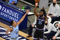 Sacramento Kings forward Chimezie Metu (25) shoots against Memphis Grizzlies guard Desmond Bane (22) in the second half of an NBA basketball game Friday, May 14, 2021, in Memphis, Tenn. (AP Photo/Brandon Dill)