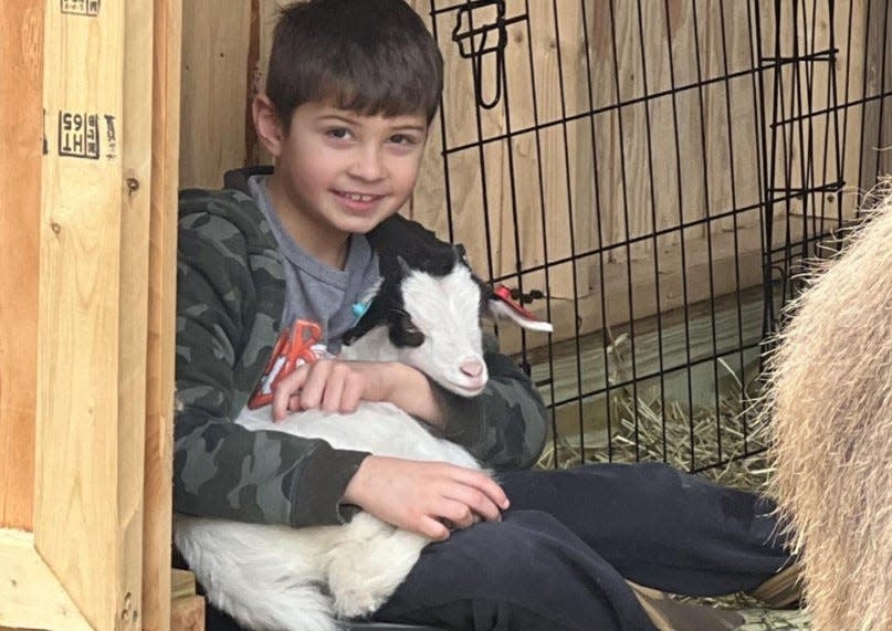 Christopher Ghazal with Lucky the "fainting" goat.