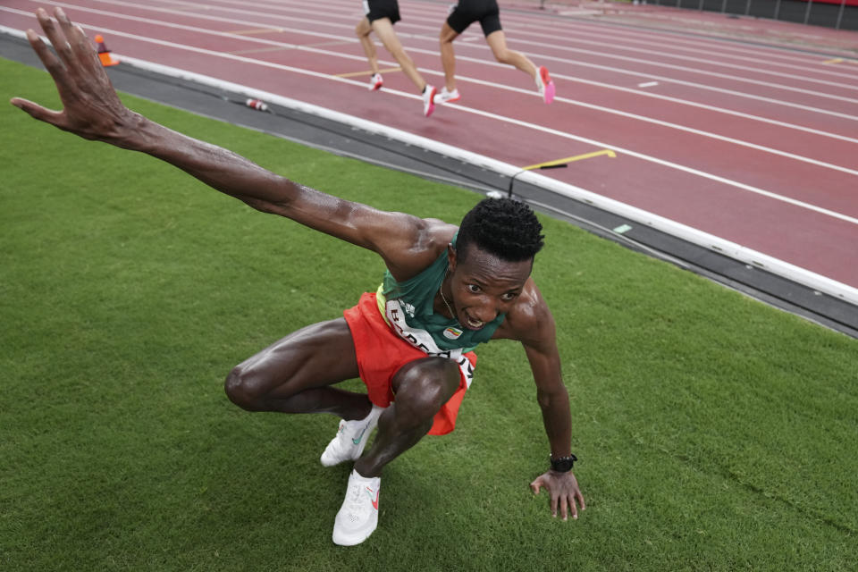 Selemon Barega, of Ethiopia, celebrates after winning the men's 10,000-meters final at the 2020 Summer Olympics, Friday, July 30, 2021, in Tokyo. (AP Photo/Matthias Schrader)