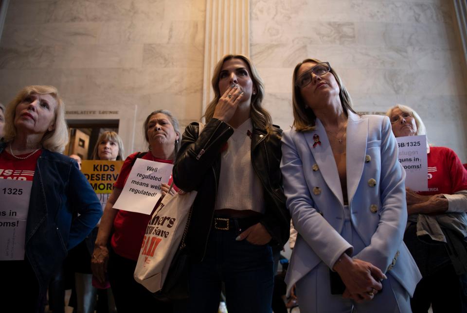 Covenant parents, Mary Joyce and Melissa Alexander stand near other protesters outside the Senate doors after being removed from the gallery at the Tennessee Capitol in Nashville, Tenn., Tuesday, April 9, 2024.