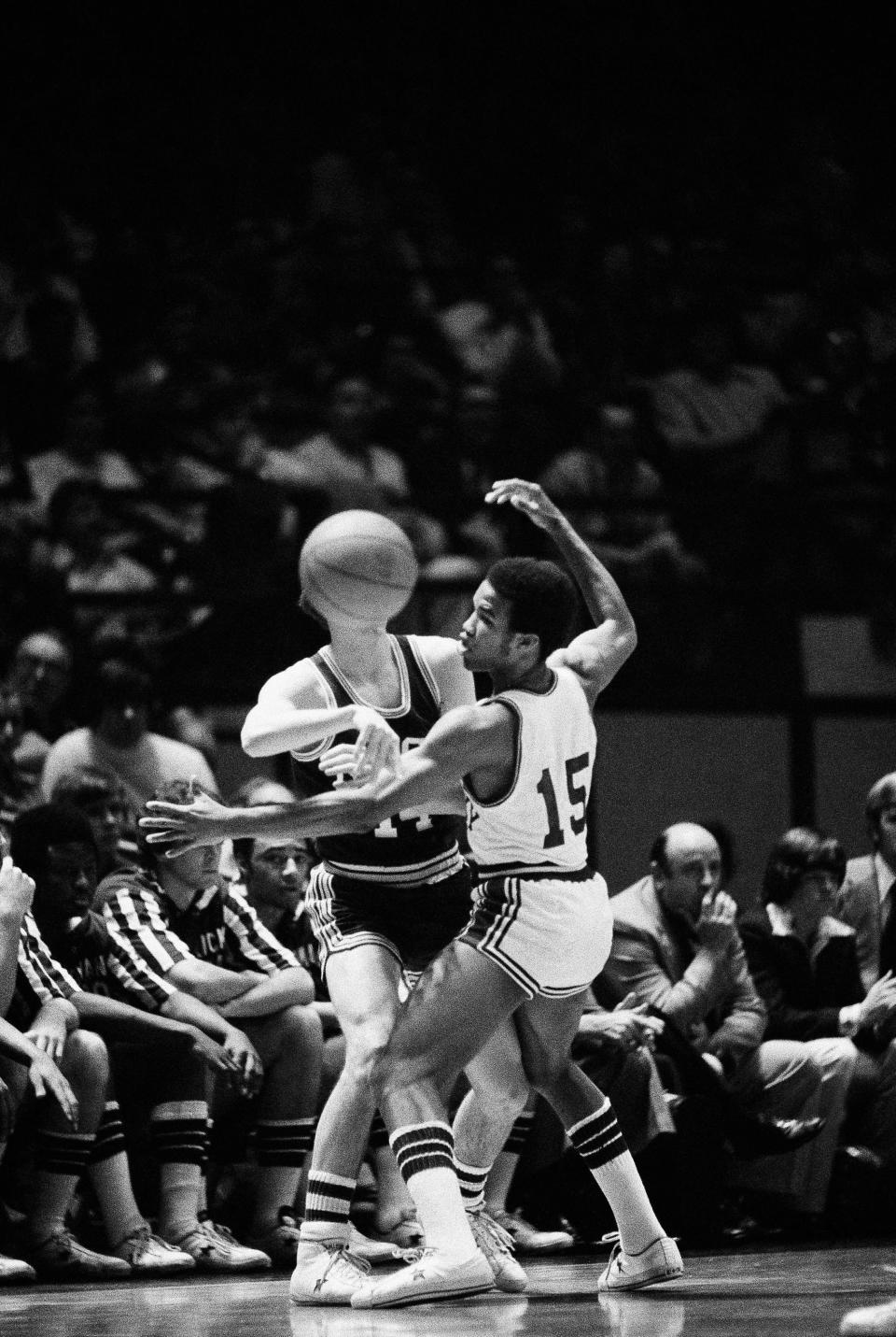 University of North Carolina at Charlotte's Bob Ball appears to get a ball full in the face as he struggles to gain possession against University of Kentucky's Reggie Warford during first half of their NIT playoff game at New York's Madison Square Garden, March 21, 1976. Kentucky won 71-67.