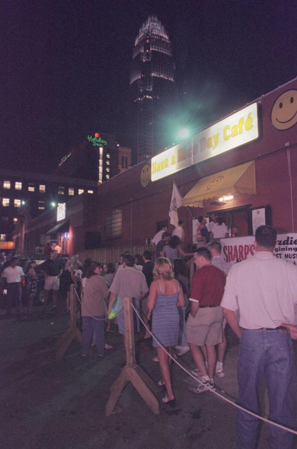 6/26/98 The NationsBank tower serves as a backdrop for a revitalized uptown entertainment and club scene Friday night. Once pronounced dead, the area has come back to life with bars, restaurants and clubs hopping every weekend. KENT D. JOHNSON/Charlotte Observer archives