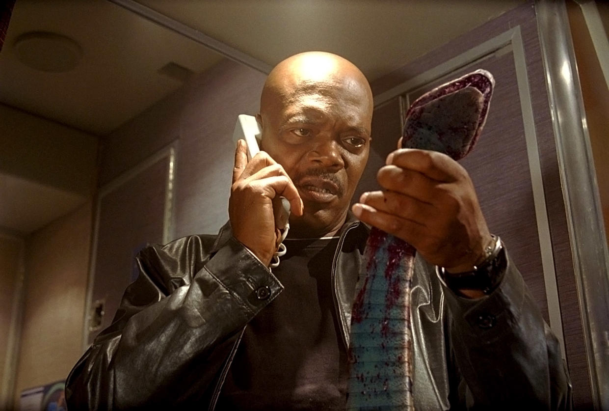 Samuel L. Jackson examines one of the villains of the 2006 thriller, 'Snakes on a Plane' (Photo: New Line Cinema / Courtesy: Everett Collection)
