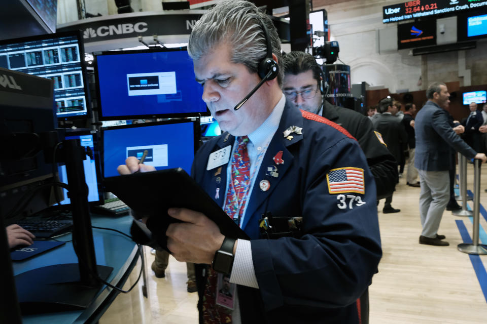 NEW YORK, NEW YORK - MARCH 18: Traders work on the floor of the New York Stock Exchange (NYSE) on March 18, 2022 in New York City. The Dow was down slightly in morning trading following a week of strong gains in stocks. (Photo by Spencer Platt/Getty Images)