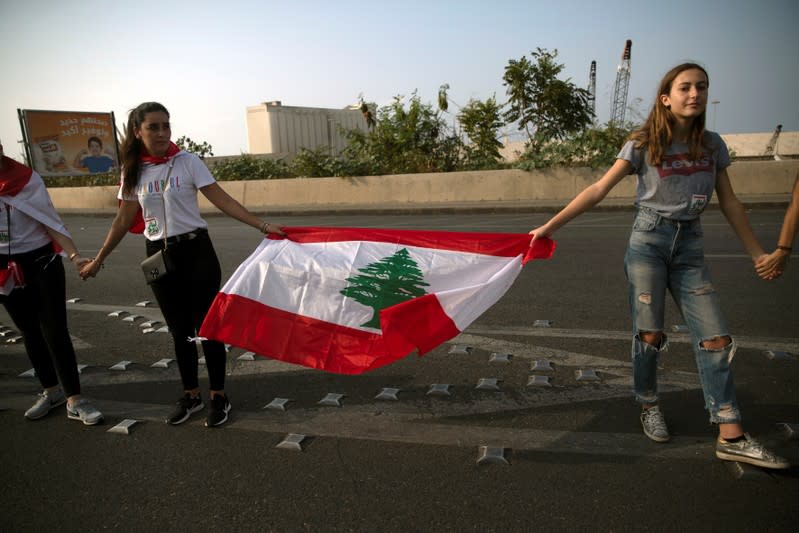 Demonstrators form a human chain during ongoing anti-government protests