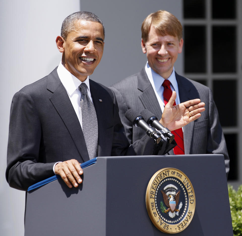 FILE - In this July 18, 2011 file photo, President Barack Obama and presidential nominee to serve as the first director of the Consumer Financial Protection Bureau (CFPB), former Ohio Attorney General Richard Cordray are seen in the Rose Garden of the White House in Washington. America's decision to re-elect President Barack Obama over Republican presidential candidate, former Massachusetts Gov. Mitt Romney will impact key sectors of the American economy.The 2010 overhaul of financial rules marked a victory for Obama. Officials who are still carrying out the details of the law may now be more likely to take a tough stance. (AP Photo/Manuel Balce Ceneta, File)