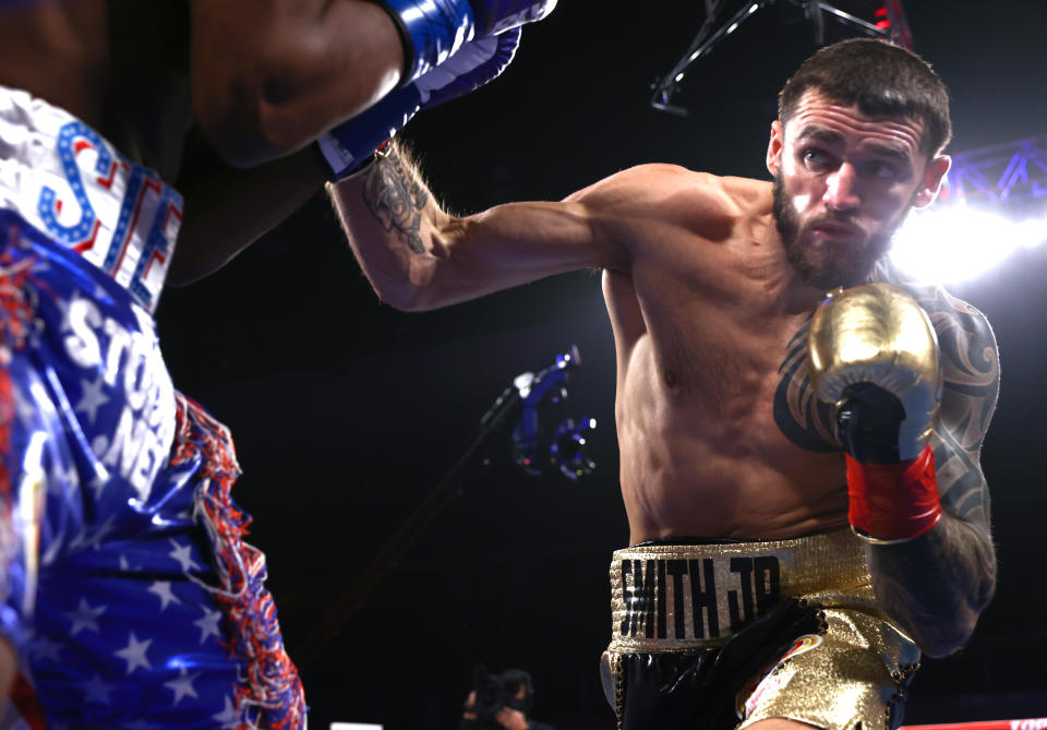 VERONA, NEW YORK - JANUARY 15: Steve Geffrard (L) and Joe Smith Jr (R) exchange punches during their fight for the WBO light heavyweight championship at Turning Stone Resort Casino on January 15, 2022 in Verona, New York. (Photo by Mikey Williams/Top Rank Inc via Getty Images)