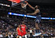 Denver Nuggets center DeAndre Jordan, right, dunks against Houston Rockets forward Tari Eason (17) during the fourth quarter of an NBA basketball game, Monday, Nov. 28, 2022, in Denver. (AP Photo/Jack Dempsey)