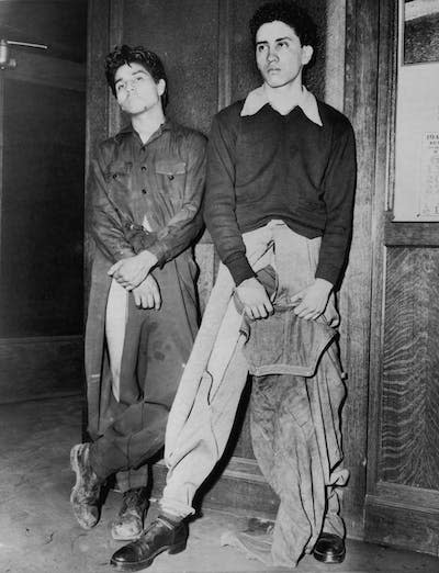 <span class="caption">Two Latino youths had their clothes slashed by angry white servicemen during the Zoot Suit Riots on Jun. 10, 1943, in Los Angeles, Calif.</span> <span class="attribution"><a class="link " href="https://www.gettyimages.com/detail/news-photo/noe-vasquez-and-joe-vasquez-latino-youths-who-reported-to-news-photo/85374830?adppopup=true" rel="nofollow noopener" target="_blank" data-ylk="slk:Anthony Potter Collection/Hulton Archive/Getty Images;elm:context_link;itc:0;sec:content-canvas">Anthony Potter Collection/Hulton Archive/Getty Images</a></span>