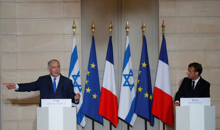 French President Emmanuel Macron and Israeli Prime Minister Benjamin Netanyahu attend a joint news conference at the Elysee Palace in Paris, France, June 5, 2018. REUTERS/Philippe Wojazer/Pool