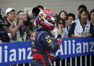 Red Bull Formula One driver Sebastian Vettel of Germany gestures after taking pole position for the qualifying session of the Korean F1 Grand Prix at the Korea International Circuit in Yeongam, October 5, 2013. Formula One championship leader Vettel will start Sunday's Korean Grand Prix on pole position for Red Bull with Lewis Hamilton's Mercedes alongside on the front row. REUTERS/Kim Hong-Ji (SOUTH KOREA - Tags: SPORT MOTORSPORT F1)