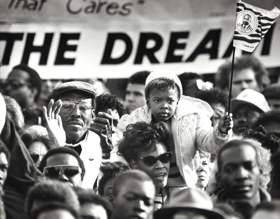 Demonstrators march in Phoenix on Jan. 19, 1987, to show their support for making Martin Luther King Jr. Day an official state holiday in Arizona.