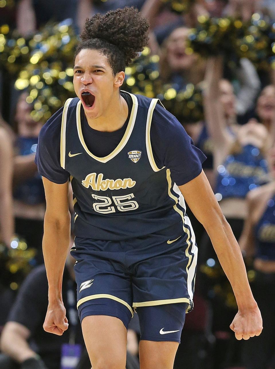 Akron's Enrique Freeman celebrates after a thunderous late-game dunk during the Zips' 75-55 win over Kent  State in the Mid-American Conference title game, Saturday March 12, 2022 in Cleveland.