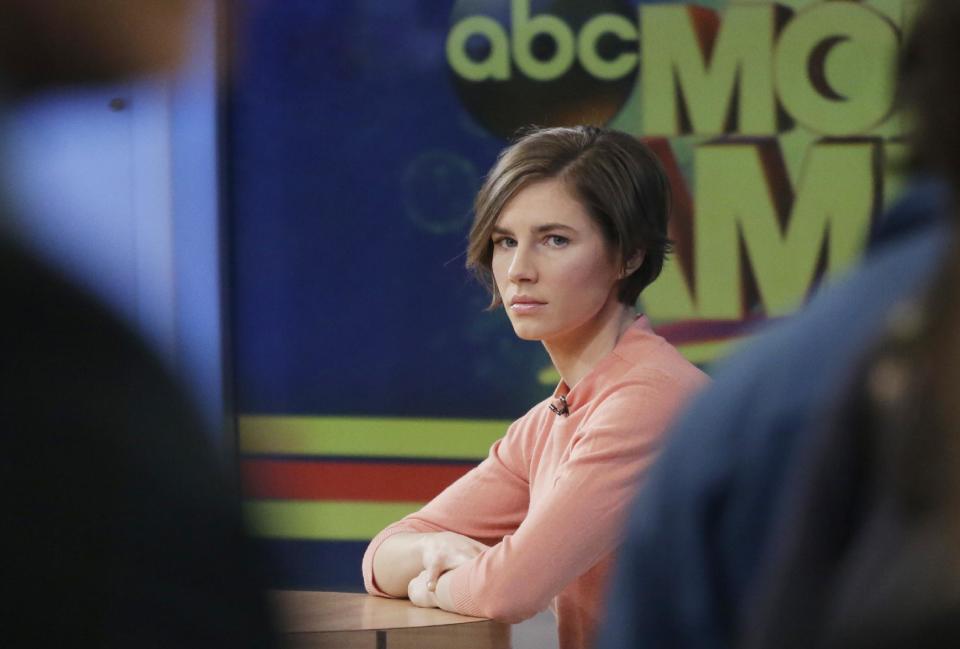 Amanda Knox waits on a television set for an interview, Friday, Jan. 31, 2014 in New York. Knox said she will fight the reinstated guilty verdict against her and an ex-boyfriend in the 2007 slaying of a British roommate in Italy and vowed to "never go willingly" to face her fate in that country's judicial system . "I'm going to fight this to the very end," she said in an interview with Robin Roberts on ABC's "Good Morning America." (AP Photo/Mark Lennihan)