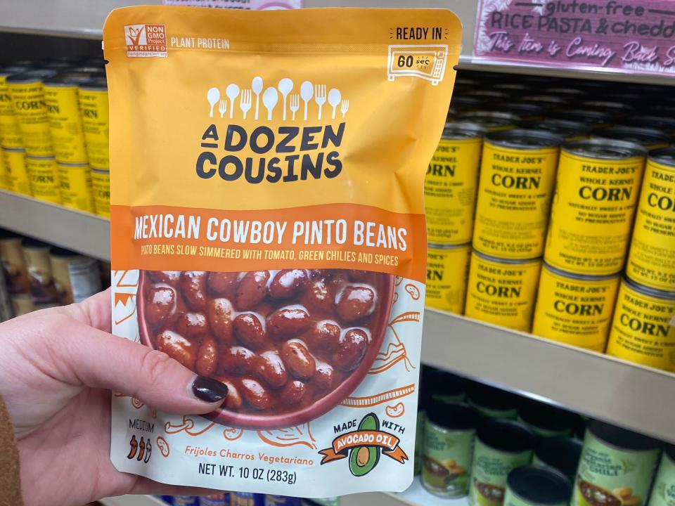 The writer holds A Dozen Cousins Mexican cowboy pinto beans