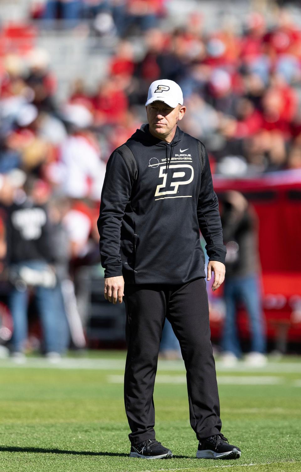 Purdue head coach Jeff Brohm watches his players warm up before playing against Nebraska in an NCAA college football game Saturday, Oct. 30, 2021, at Memorial Stadium in Lincoln, Neb. (AP Photo/Rebecca S. Gratz)