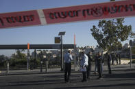 Israeli police inspect the scene of an explosion at a bus stop in Jerusalem, Wednesday, Nov. 23, 2022. Two blasts went off near bus stops in Jerusalem on Wednesday, injuring several people in what police said were suspected attacks by Palestinians. (AP Photo/Maya Alleruzzo)