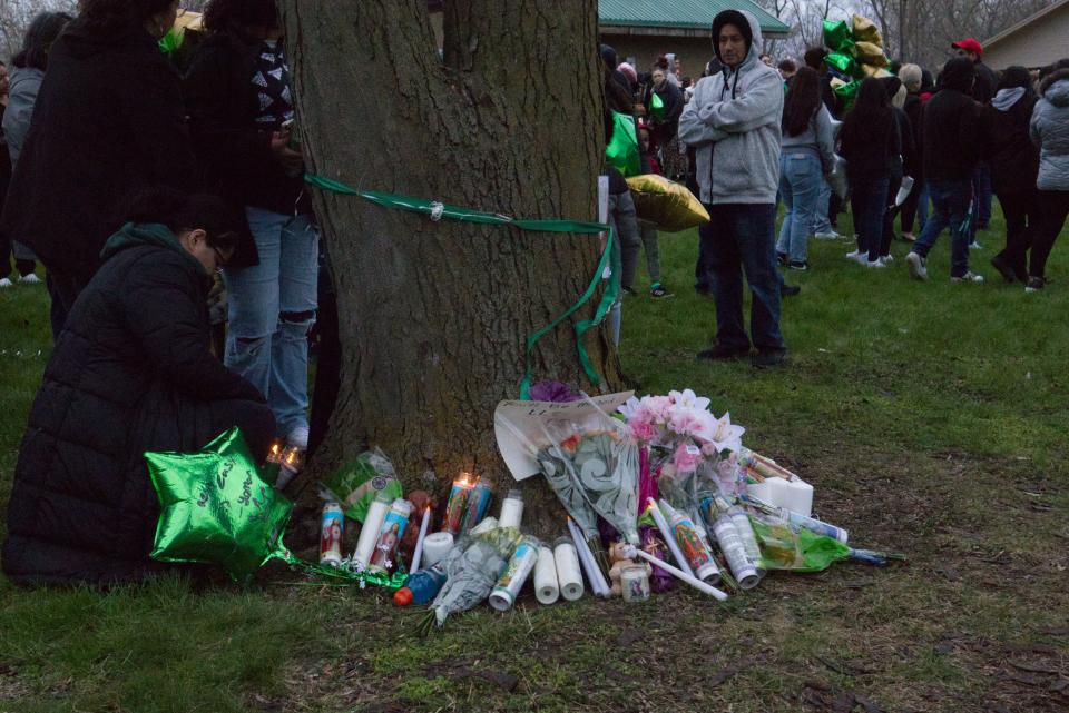 An altar for Ema Cardenas slowly grows as people add to and pay respects to her