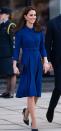 <p>Kate stepped out in a blue coat dress by <a href="http://www.eponinelondon.com/aw-16-1" rel="nofollow noopener" target="_blank" data-ylk="slk:Eponine;elm:context_link;itc:0;sec:content-canvas" class="link ">Eponine</a>, which she'd worn <a href="https://www.townandcountrymag.com/style/fashion-trends/a25058717/kate-middleton-recycle-eponine-cota-dress-south-yorkshire-photos/" rel="nofollow noopener" target="_blank" data-ylk="slk:once before in 2017.;elm:context_link;itc:0;sec:content-canvas" class="link ">once before in 2017.</a> The Duchess styled her outfit with navy stilettos from <a href="https://www.net-a-porter.com/us/en/Shop/Designers/Rupert_Sanderson?cm_mmc=LinkshareUS-_-tv2R4u9rImY-_-Custom-_-LinkBuilder&siteID=tv2R4u9rImY-JoE9OpvJZ9WOW.hrlHo8Xg&Skimlinks+%28Variable+Pricing%29=Skimlinks+%28Variable+Pricing%29&dclid=CjkKEQiArK_fBRCn8-rxz42j3bgBEiQAFHPBMEbPaYejrHq0Xs3_Sz8r2pLWKoU7GOw8bgTZz37EIhvw_wcB&pn=1&npp=60&image_view=product&dScroll=0" rel="nofollow noopener" target="_blank" data-ylk="slk:Rupert Sanderson;elm:context_link;itc:0;sec:content-canvas" class="link ">Rupert Sanderson</a>, sapphire drop earrings, and a black clutch. </p>