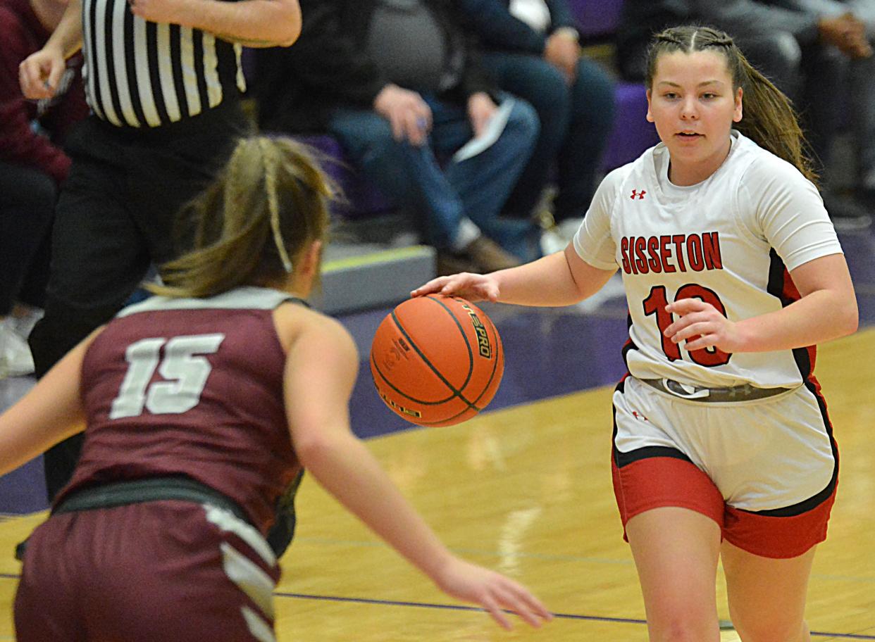 Sisseton's Hannah Leverson advances the ball against Tri-Valley's Hailey Sorenson during their Class A SoDak 16 girls basketball game on Thursday, Feb. 29, 2024 in the Watertown Civic Arena. Sisseton won 63-52.