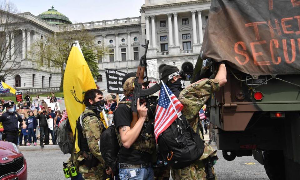 People take part in a ‘reopen’ protest in Harrisburg, Pennsylvania, on 20 April.