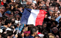 A supporter holds a french flag during a political rally of Jean-Luc Melenchon of the French far left Parti de Gauche and candidate for the 2017 French presidential election, in Toulouse, Southwestern France, April 16, 2017. REUTERS/Regis Duvignau