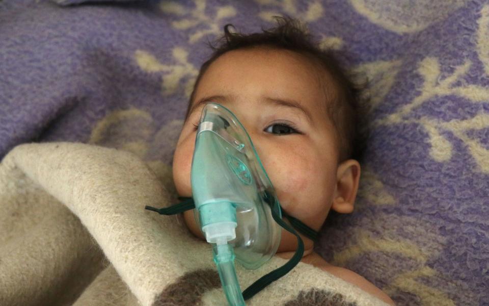 A Syrian child receives treatment following a suspected toxic gas attack in Khan Sheikhun, a rebel-held town in the northwestern Syrian Idlib province - Credit: Getty
