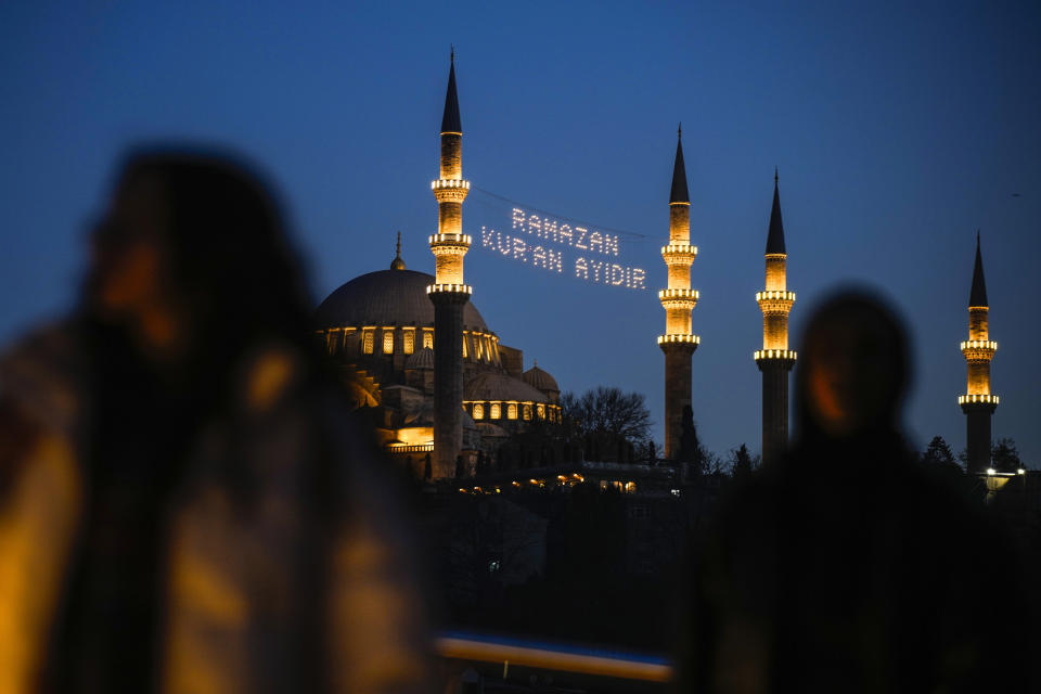 A message in lights is installed in between the minarets of the Suleymaniye mosque ahead of the Muslim holy month of Ramadan in Istanbul, Turkey, Sunday, March 10, 2024. The message reads in Turkish "Ramadan is the month of Quran." (AP Photo/Emrah Gurel)