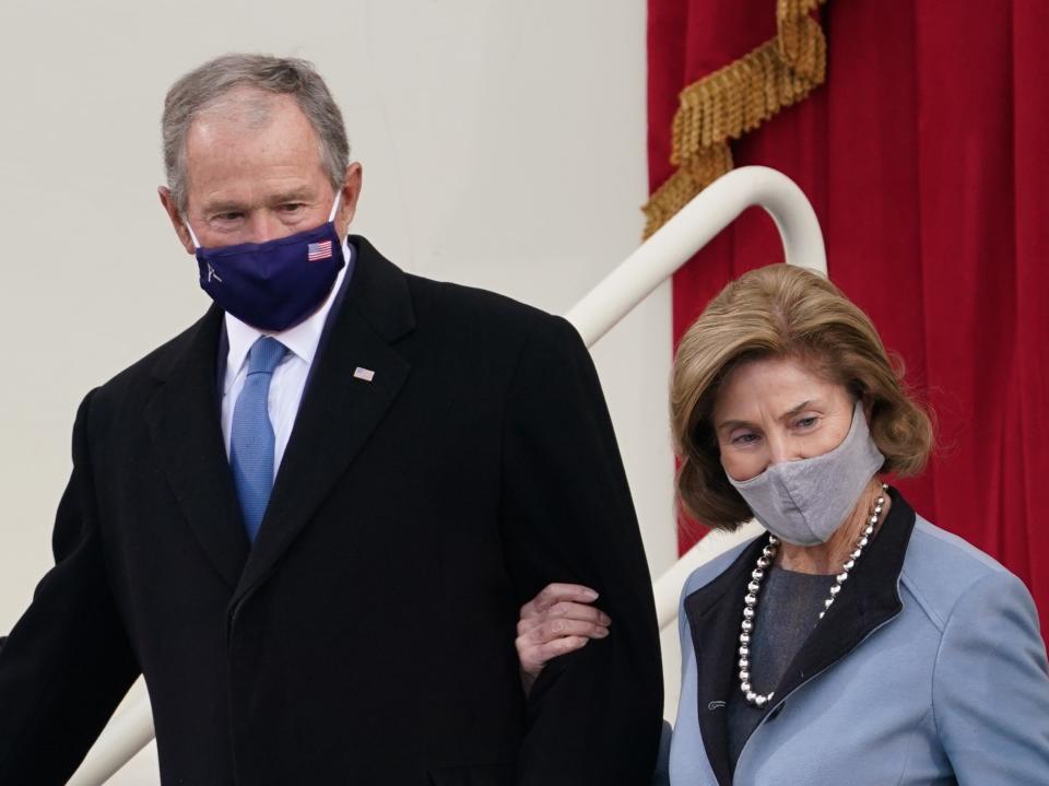 Former President George W Bush and his wife Laura Bush arrive for the inauguration ceremony of Joe Biden as the 46th President of the United States on the West Front of the CapitolREUTERS