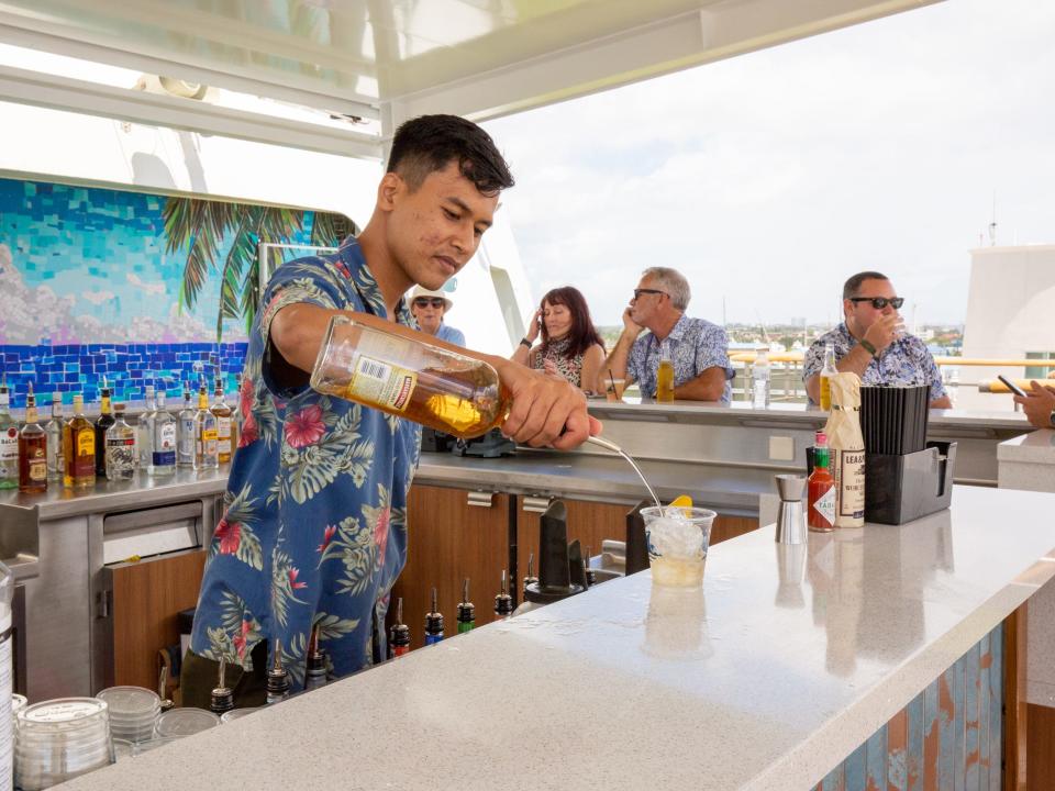 A bartender preparing a drink.