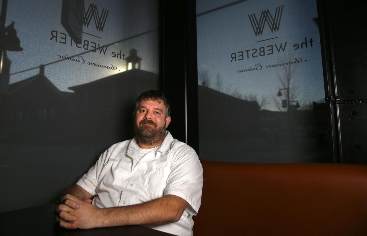 Sam Gelman poses for a portrait Monday, Dec. 11, 2023 at the Webster in downtown Iowa City, Iowa.