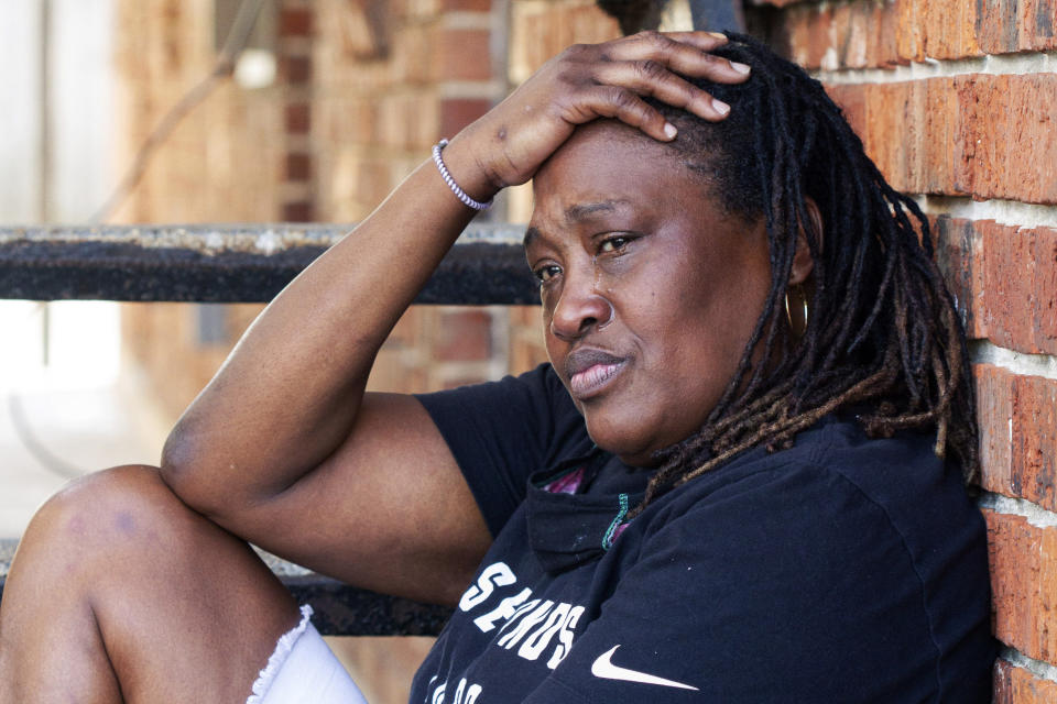 Natasha Blunt poses for a portrait in New Orleans, Friday, July 31, 2020. Blunt owes thousands of dollars in back rent after she lost her banquet porter job. She has yet to receive her stimulus check and has not been approved for unemployment benefits. Her family is getting by with food stamps and the charity of neighbors. (AP Photo/Dorthy Ray)