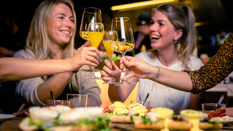 friends toasting at brunch