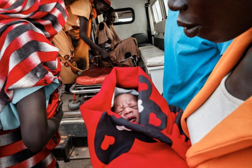 Awar is sent to hospital in an ambulance from Gongoi IDP camp where she had twins the previous night. She is feeling very weak and unwell and has lost a lot of blood and is still bleeding. August, 2023.<span class="copyright">Sean Sutton—Panos Pictures/Redux</span>