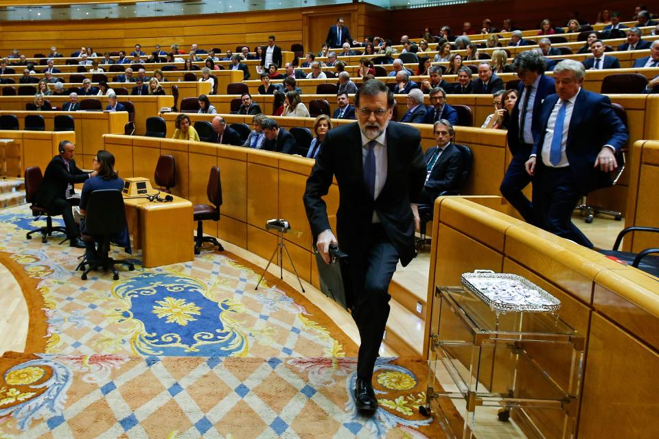 Spain’s Prime Minister Mariano Rajoy leaves a session of the Upper House of Parliament in Madrid on Oct. 27. (Photo: Oscar del Pozo/AFP/Getty Images)