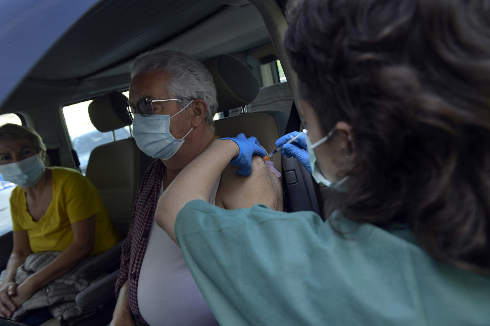 Manuel Santamaria, 76, receives a shot of Pfizer vaccine during a COVID-19 vaccination campaign, in Pamplona, northern Spain, Friday, May 7, 2021.(AP Photo/Alvaro Barrientos)