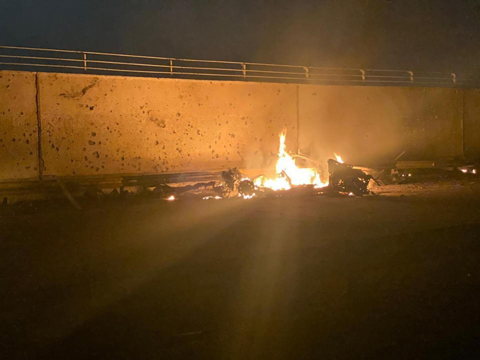 This photo released by the Iraqi Prime Minister Press Office shows a burning vehicle at the Baghdad International Airport following an airstrike, in Baghdad, Iraq, early Friday, Jan. 3, 2020. The Pentagon said Thursday that the U.S. military has killed Gen. Qassem Soleimani, the head of Iran's elite Quds Force, at the direction of President Donald Trump. (Iraqi Prime Minister Press Office via AP)