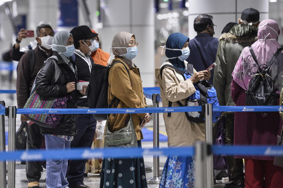 Passengers wearing masks at KLIA March 10, 2020. — Picture by Miera Zulyana