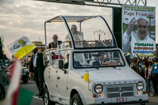 Crowds gathered on Satuday to welcome the pope as he made his way in his popemobile to Soamandrakizay stadium
