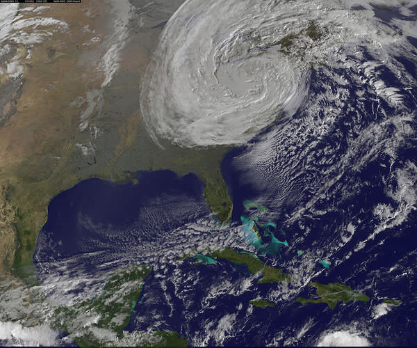 NOAA's GOES-13 satellite captured a visible image of post-tropical cyclone Sandy rolling overland this morning (Oct. 30) at 6:02 a.m. EDT.