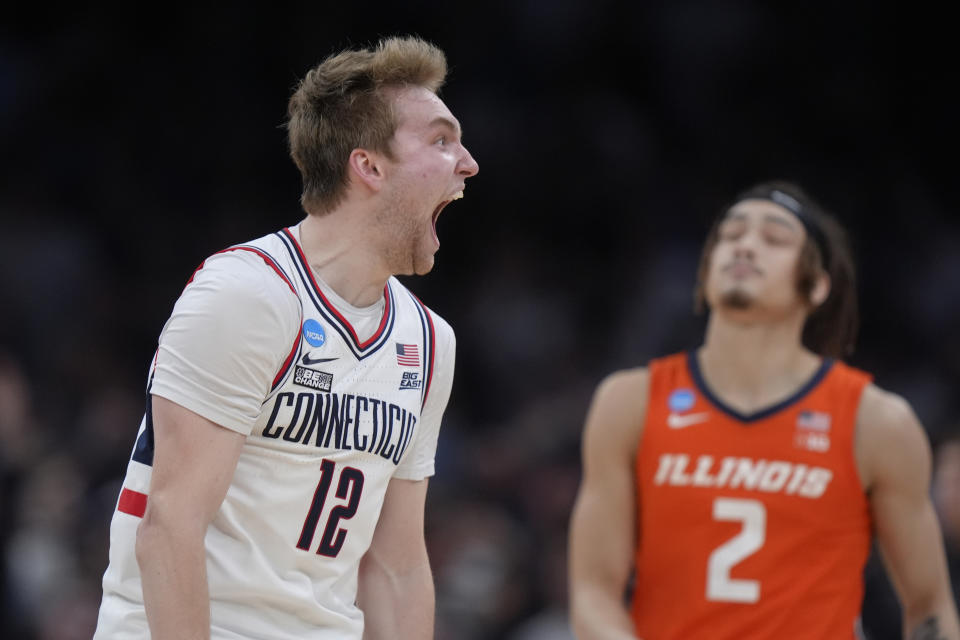 UConn guard Cam Spencer (12) celebrates during the second half of the Elite 8 college basketball game against against the Illinois in the men's NCAA Tournament, Saturday, March 30, 2024, in Boston. (AP Photo/Steven Senne)