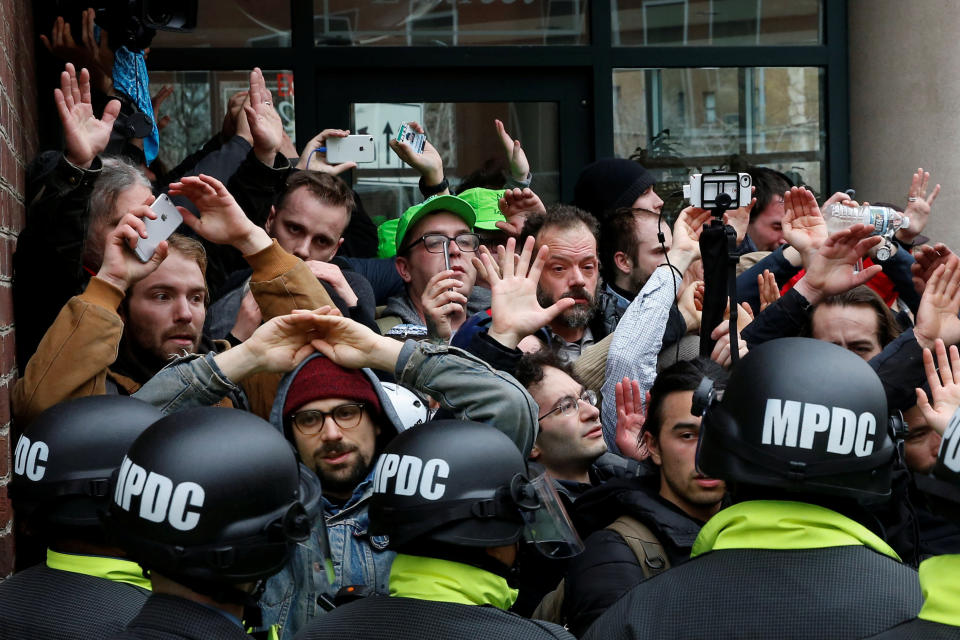 Protesters demonstrating against Trump raise their hands as they are surrounded by police on the sidelines of the inauguration in Washington, Jan. 20, 2017. (Photo: Adrees Latif / Reuters)