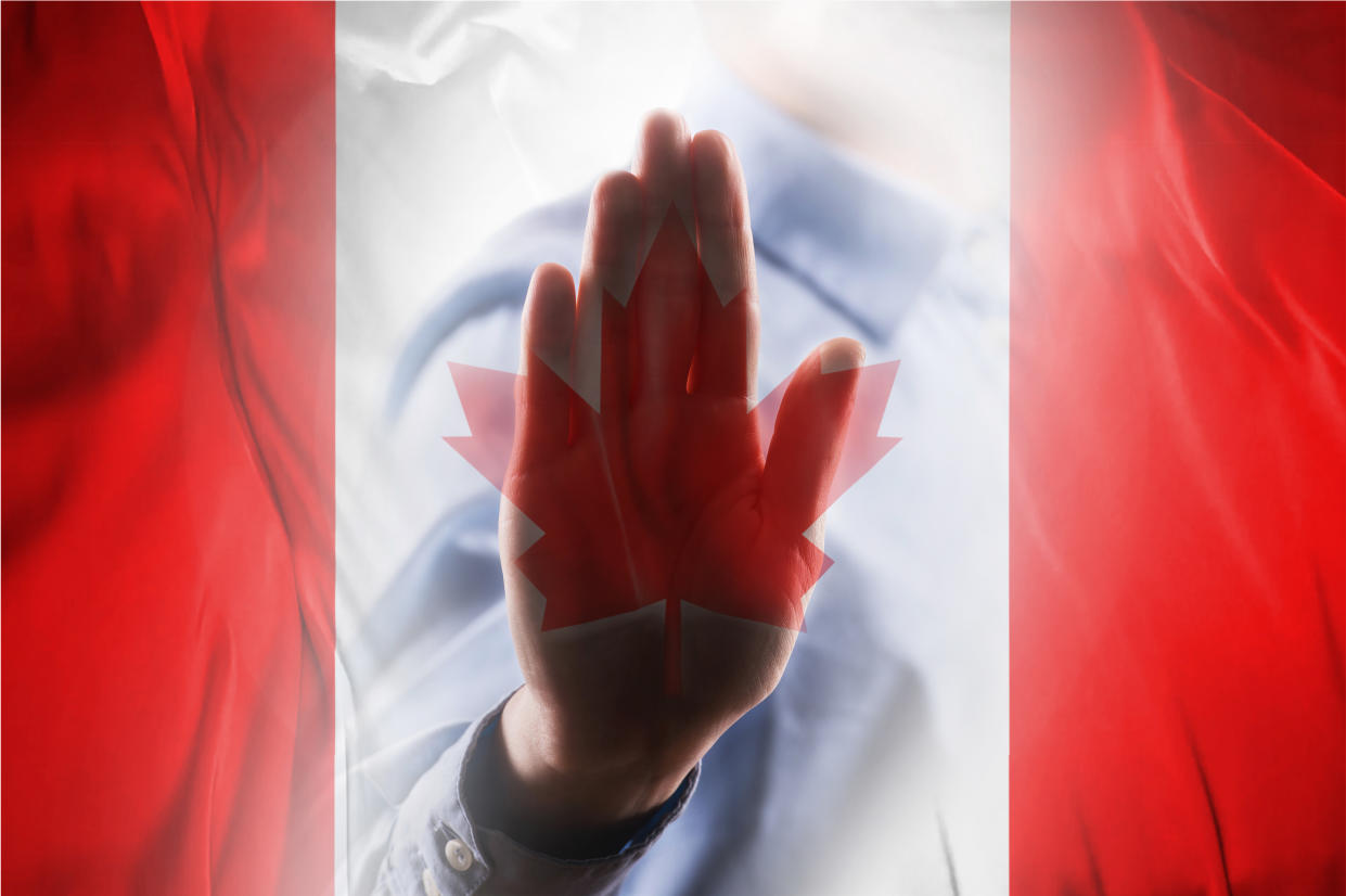 CANADA FLAG with hand STOP SIGN / Flag concept (Click for more)