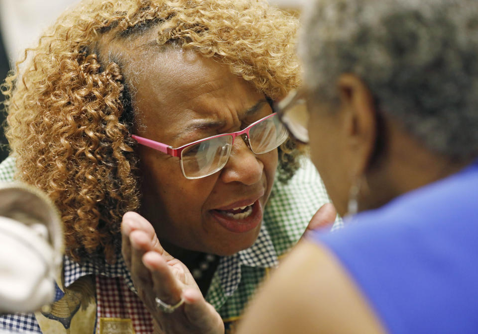 In this Aug. 24, 2018 photograph, Cindy Ayers, CEO of Foot Print Farms, left, confers with her friend Imalika Adams Johnson, a veteran of the civil rights movement, at a Black Women Matter Issues Forum of several Mississippi grassroots political organizations with the Black Voters Matter field team in Jackson, Miss. The gathering was the final portion of a bus tour that was in part to introduce national media to these hands-on organizations and to allow the groups to interact and build interest and excitement for the upcoming election, developing concern for local issues, and documenting the campaigning in locales where black turnout might be key to winning. (AP Photo/Rogelio V. Solis)