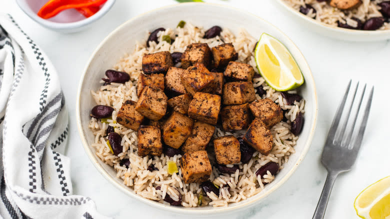 Jerk tofu in bowl with rice and peas