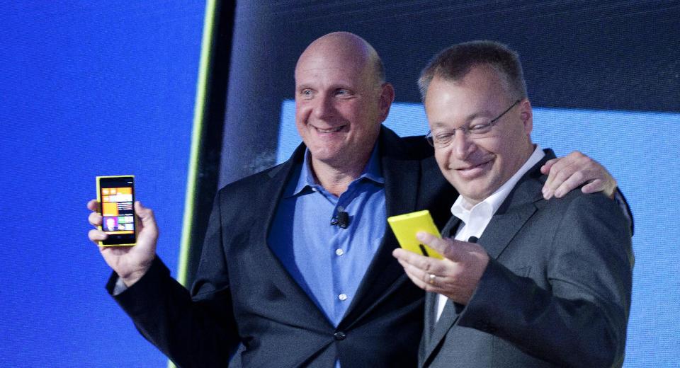 Steve Ballmer, left, Chairman and CEO of Microsoft, and Stephen Elop, CEO of Nokia, introducee Nokia's newest smartphone, the Lumia 920, equipped with Microsoft's Windows Phone 8, Wednesday, Sept. 5, 2012 in New York. Nokia revealed its first smartphones to run the next version of Windows, a big step for a company that has bet its future on an alliance with Microsoft. (AP Photo/Mark Lennihan)