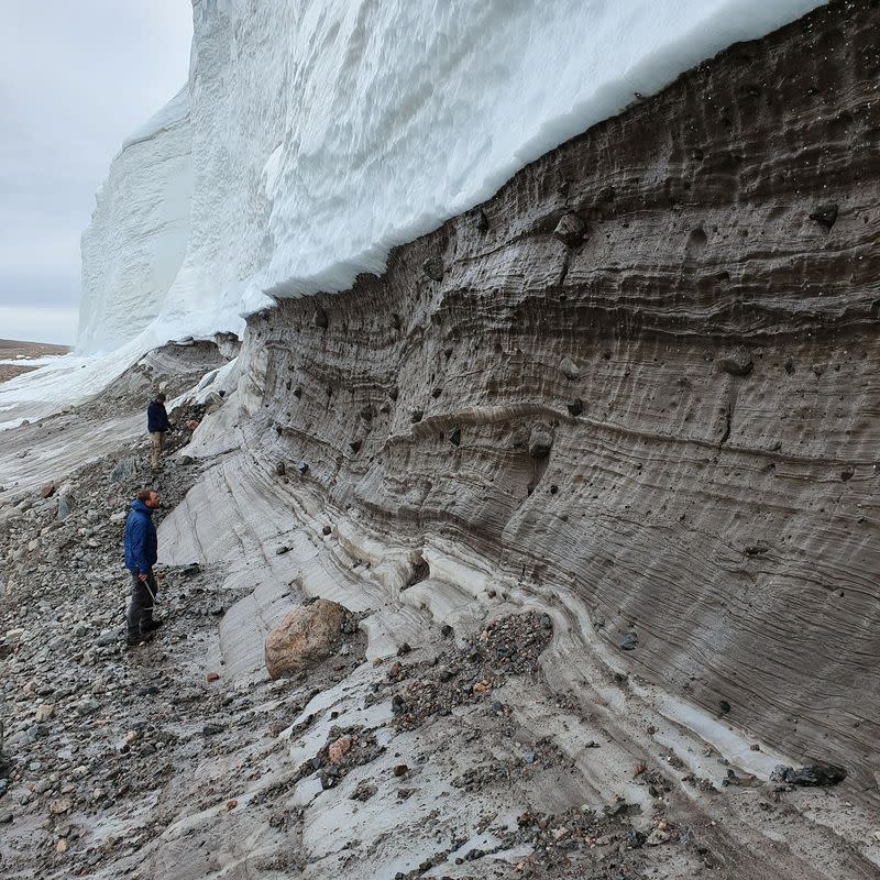 Scientists perform research field work at the edge of the Greenland Ice Sheet