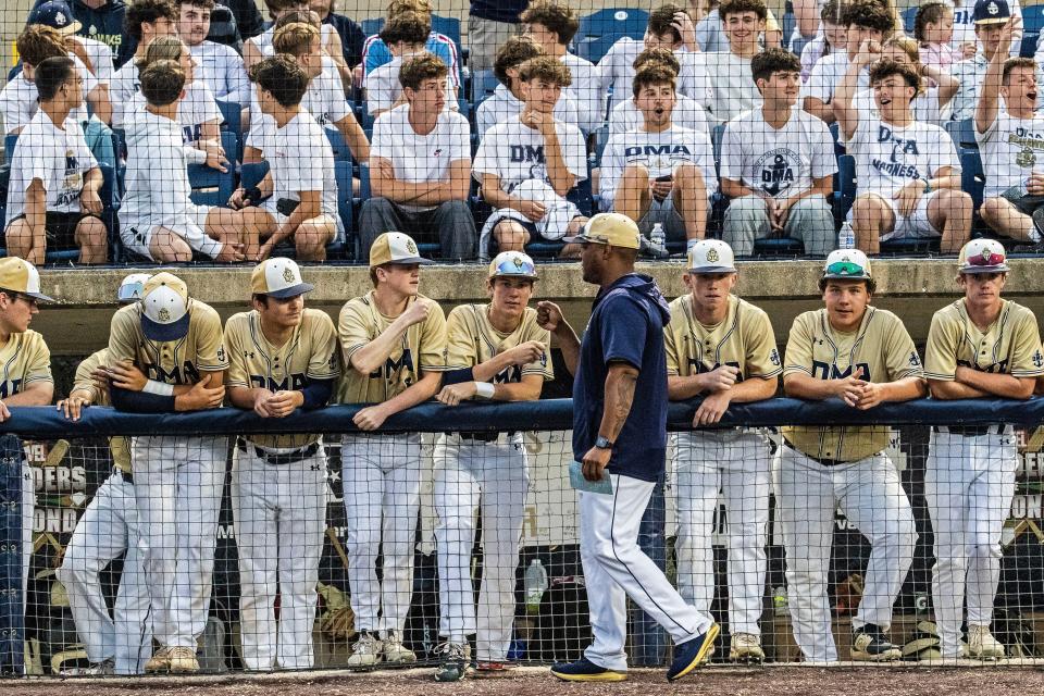 Delaware Military Academy head coach Aaron Lewis first pumps with the team at the dugout before the start of the DMA vs. Conrad DIAA Baseball championship game at Frawley Stadium in Wilmington on Saturday, June 3, 2023. DMA won 7-1.