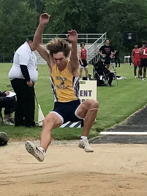 River Valley's Grant Butler leaps during the Division II boys long jump regional competition at Lexington this season. Butler played boys tennis as a sophomore last spring.